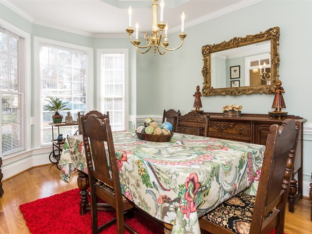 8004 Millenium Drive Raleigh, NC 27614 - Photo 5 of 24 Elegant dining room w/ bay window and wood floors. Dining Room