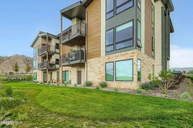 a view of a building with a yard