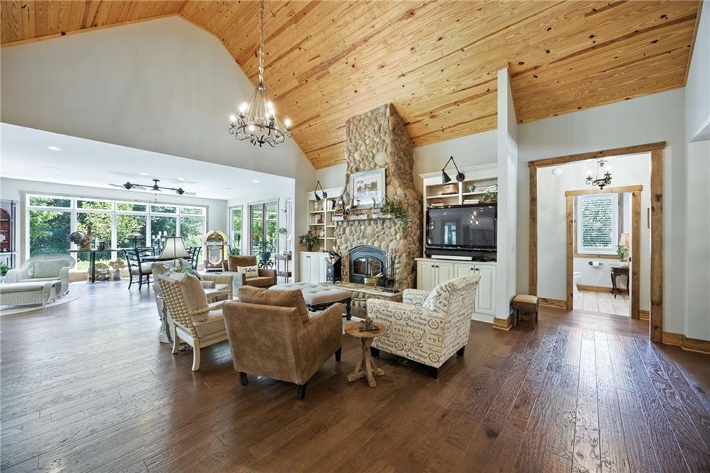 1620 Pond Fork Church Road Talmo, GA 30575 - Photo 13 of 73 a living room with fireplace furniture and a large window