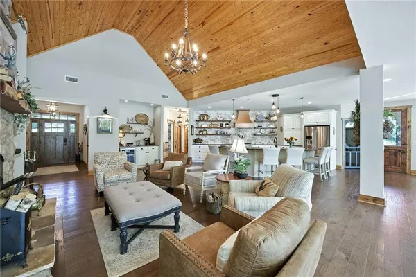 a living room with furniture and large windows