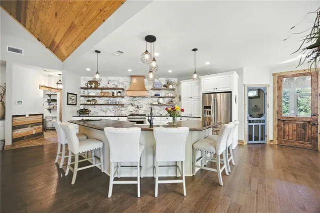a view of a porch with chairs and plants