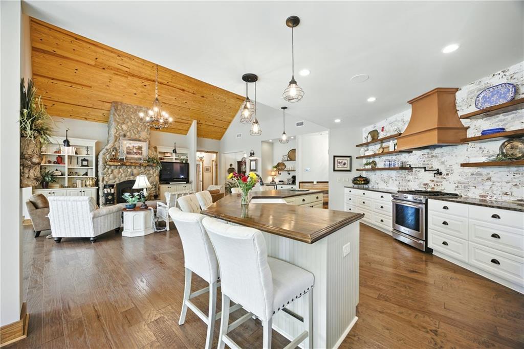 1620 Pond Fork Church Road Talmo, GA 30575 - Photo 20 of 73 a kitchen with stainless steel appliances granite countertop a sink a stove and a wooden floors