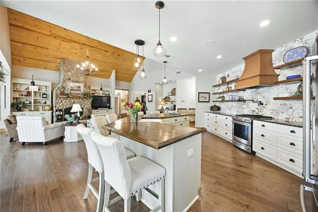 a spacious bathroom with a sink a mirror and a shower