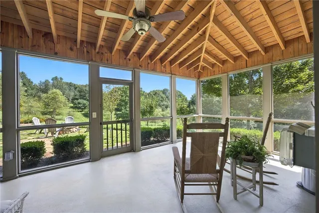a spacious bathroom with a sink a large mirror and a shower