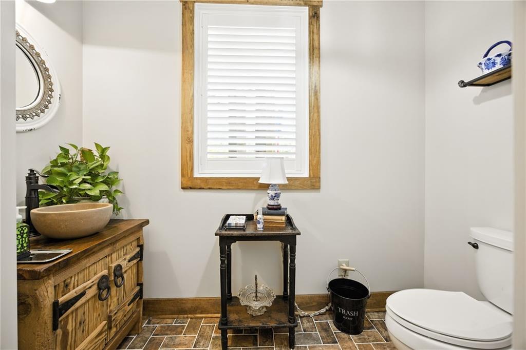 1620 Pond Fork Church Road Talmo, GA 30575 - Photo 28 of 73 a bathroom with a toilet sink and mirror