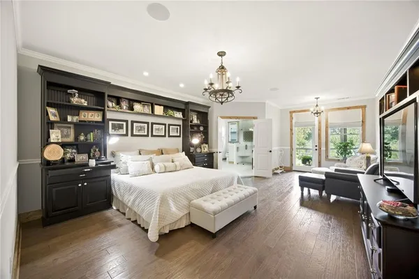 a view of a house with a yard and potted plants