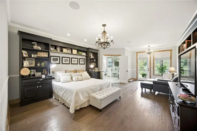 a view of a house with a yard and potted plants