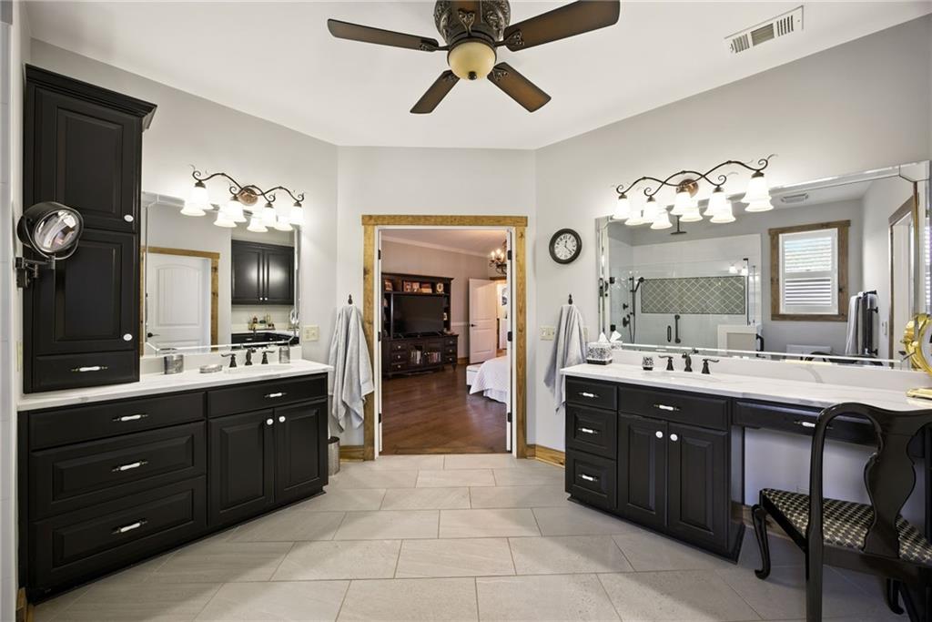 1620 Pond Fork Church Road Talmo, GA 30575 - Photo 34 of 73 a spacious bathroom with a sink a large mirror and a shower