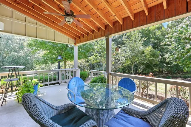 a view of a patio with table and chairs and potted plants