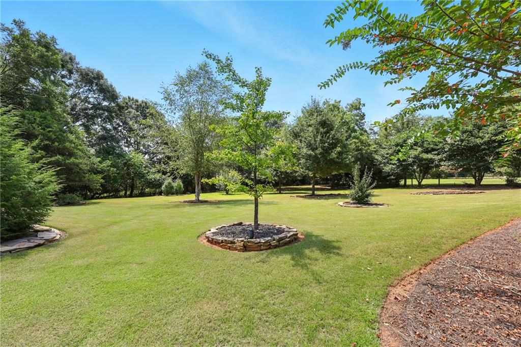 1620 Pond Fork Church Road Talmo, GA 30575 - Photo 48 of 73 a swimming pool with trees in the background