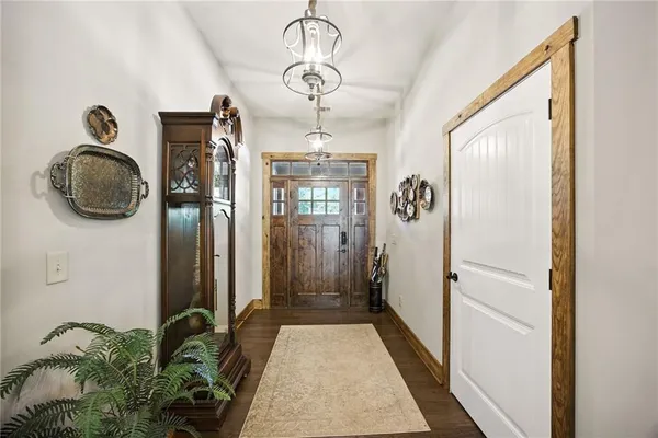 a kitchen with stainless steel appliances kitchen island granite countertop a sink and cabinets