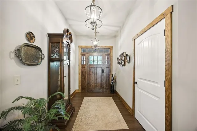 a kitchen with stainless steel appliances kitchen island granite countertop a sink and cabinets