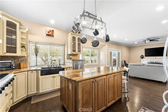 a kitchen with stainless steel appliances granite countertop a sink and cabinets