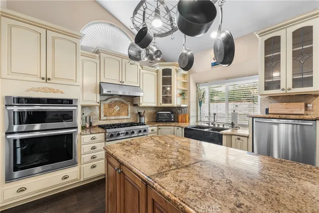 a kitchen with a stove and a microwave