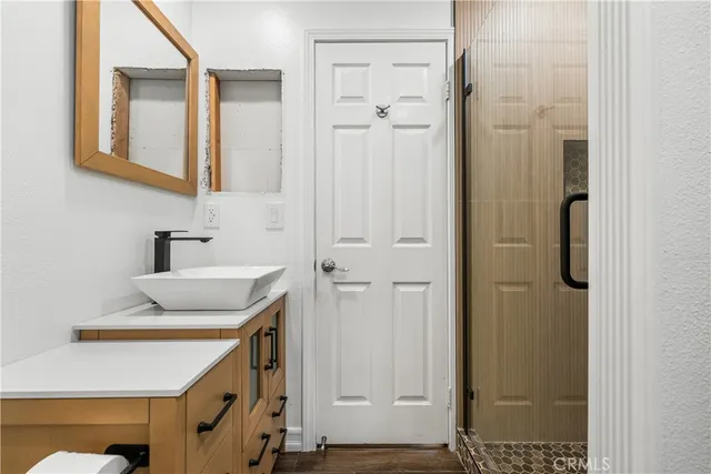 a bathroom with a sink and a mirror