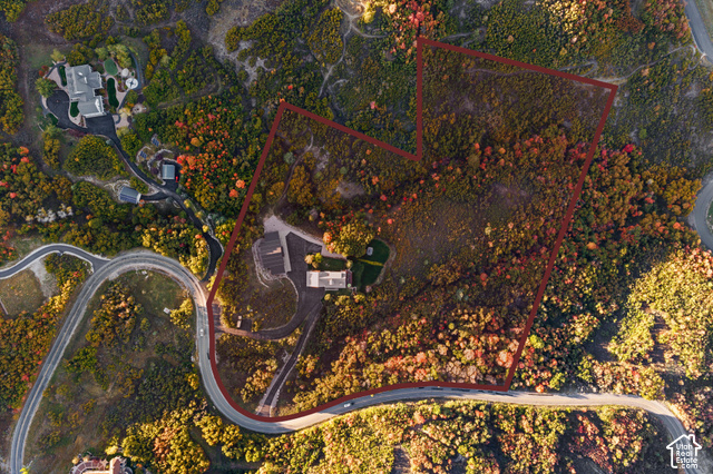 5878 Snowbasin Road Huntsville, UT 84317 - Photo 80 of 90 Expansive natural terrain surrounding a curved roadway, featuring a structured lot outline and established residences