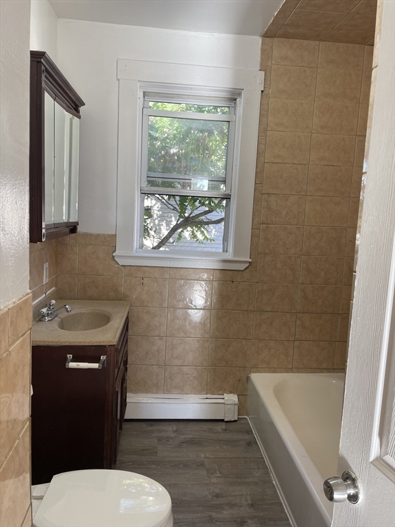 18 Lawton Avenue, Unit 3 Lynn, MA 01902 - Photo 16 of 24 a bathroom with a sink a toilet and bathtub