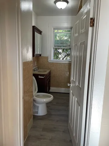 a bathroom with a toilet and a sink
