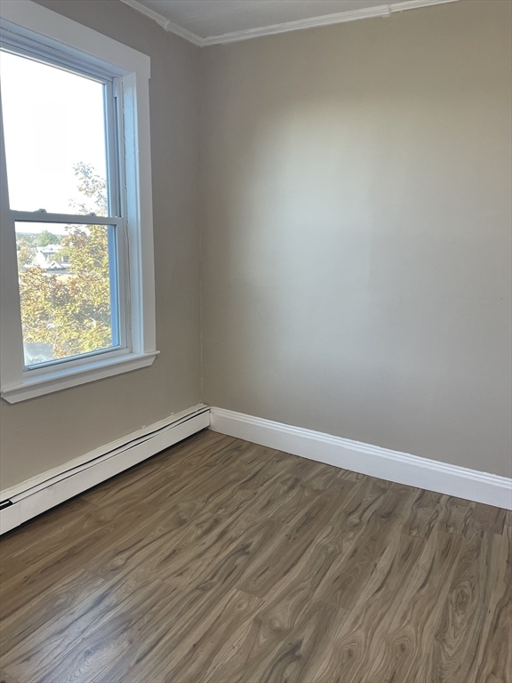 18 Lawton Avenue, Unit 3 Lynn, MA 01902 - Photo 18 of 24 wooden floor in an empty room with a window