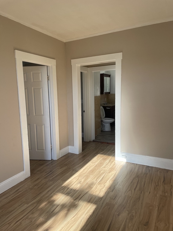 18 Lawton Avenue, Unit 3 Lynn, MA 01902 - Photo 22 of 24 a view of a livingroom with wooden floor and closet