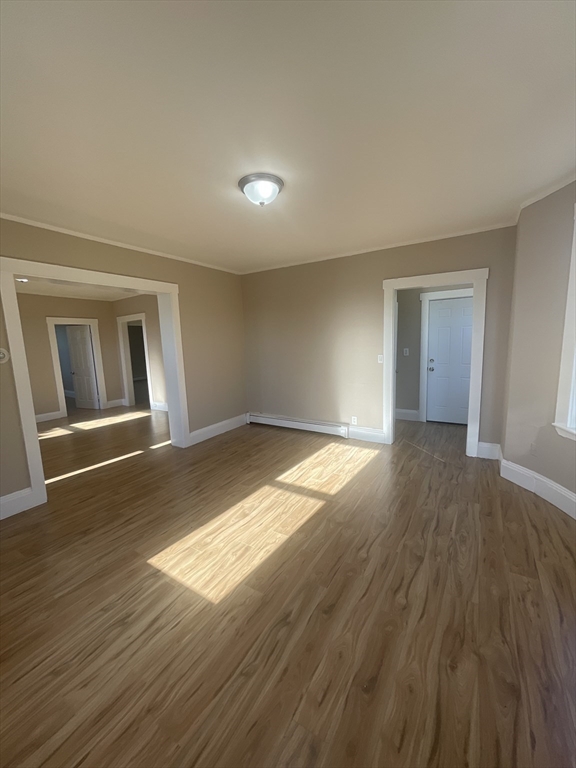 18 Lawton Avenue, Unit 3 Lynn, MA 01902 - Photo 3 of 24 a view of empty room with wooden floor