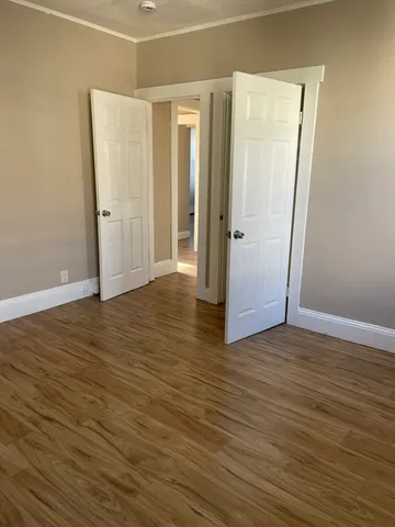 a view of wooden floor in an empty room