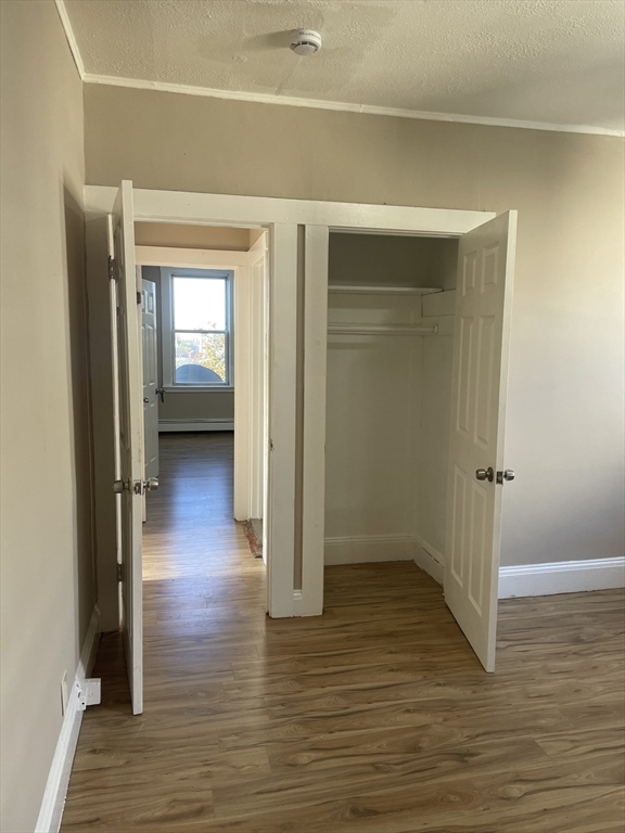 18 Lawton Avenue, Unit 3 Lynn, MA 01902 - Photo 6 of 24 a view of a hallway with wooden floor