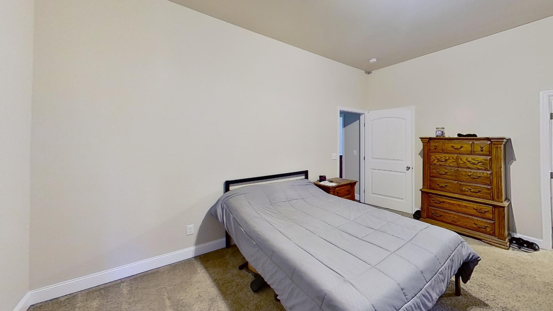 2314 Joe Brown Road Spring Hill, TN 37174 - Photo 18 of 28 a bedroom with a bed and cabinets