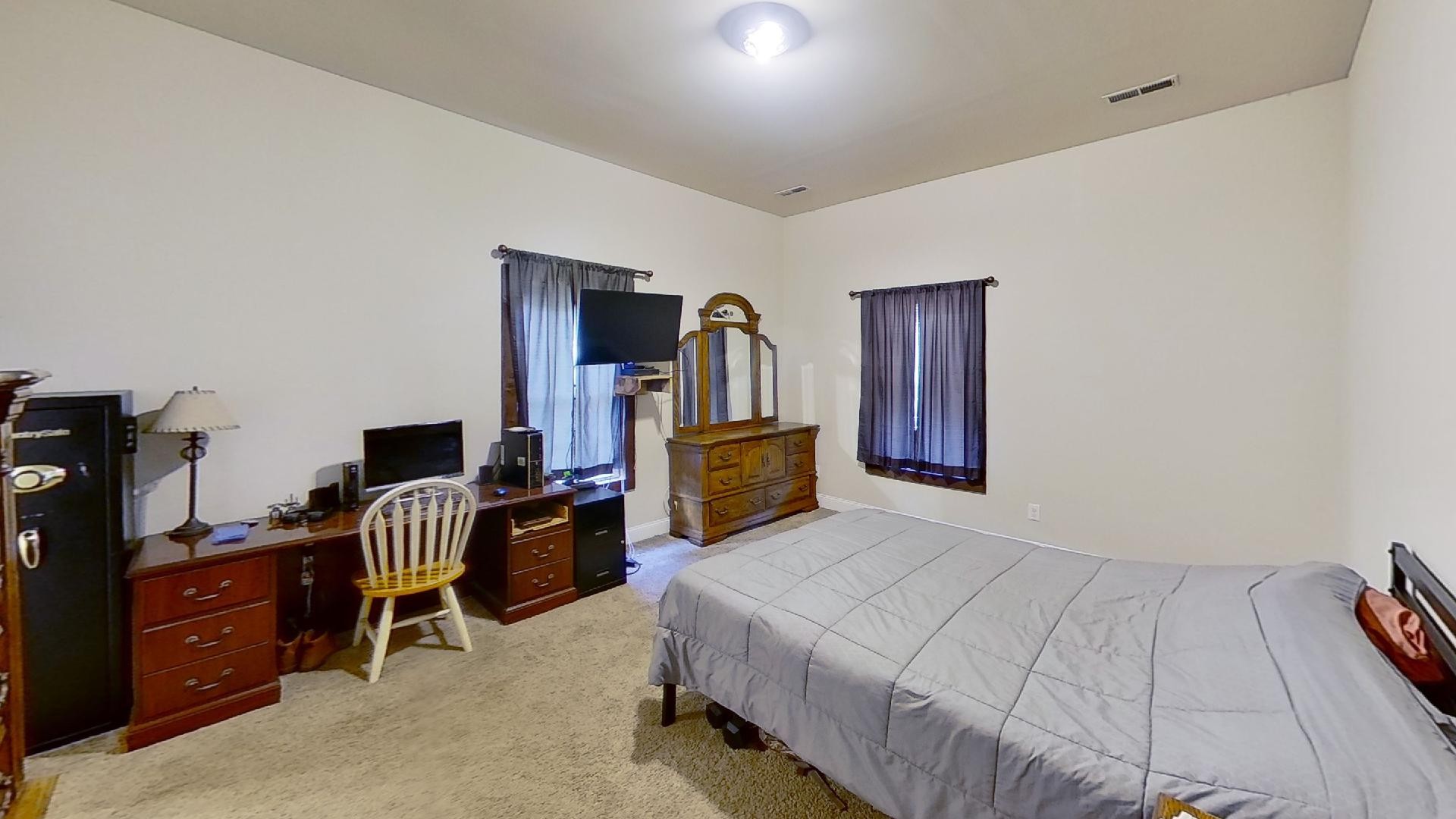 2314 Joe Brown Road Spring Hill, TN 37174 - Photo 19 of 28 a bedroom with a bed and furniture