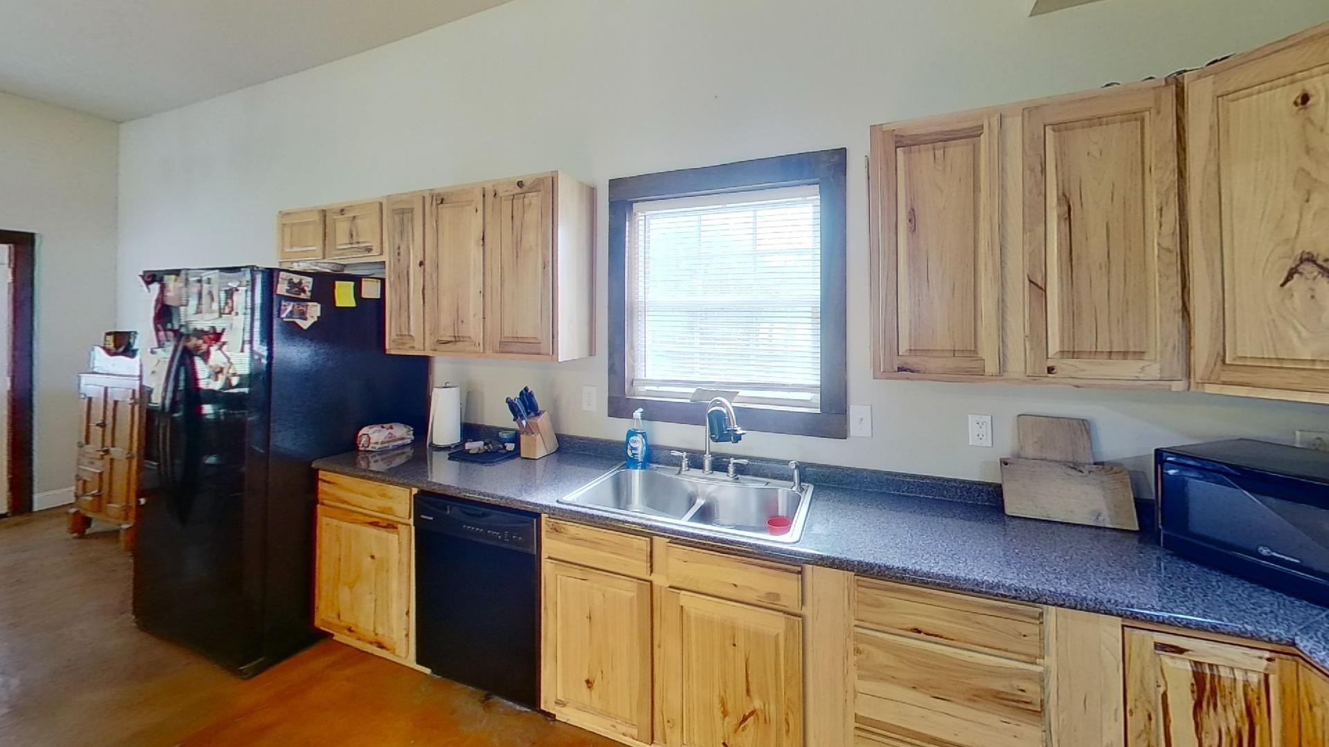 2314 Joe Brown Road Spring Hill, TN 37174 - Photo 20 of 28 a kitchen with stainless steel appliances granite countertop a sink dishwasher stove and refrigerator