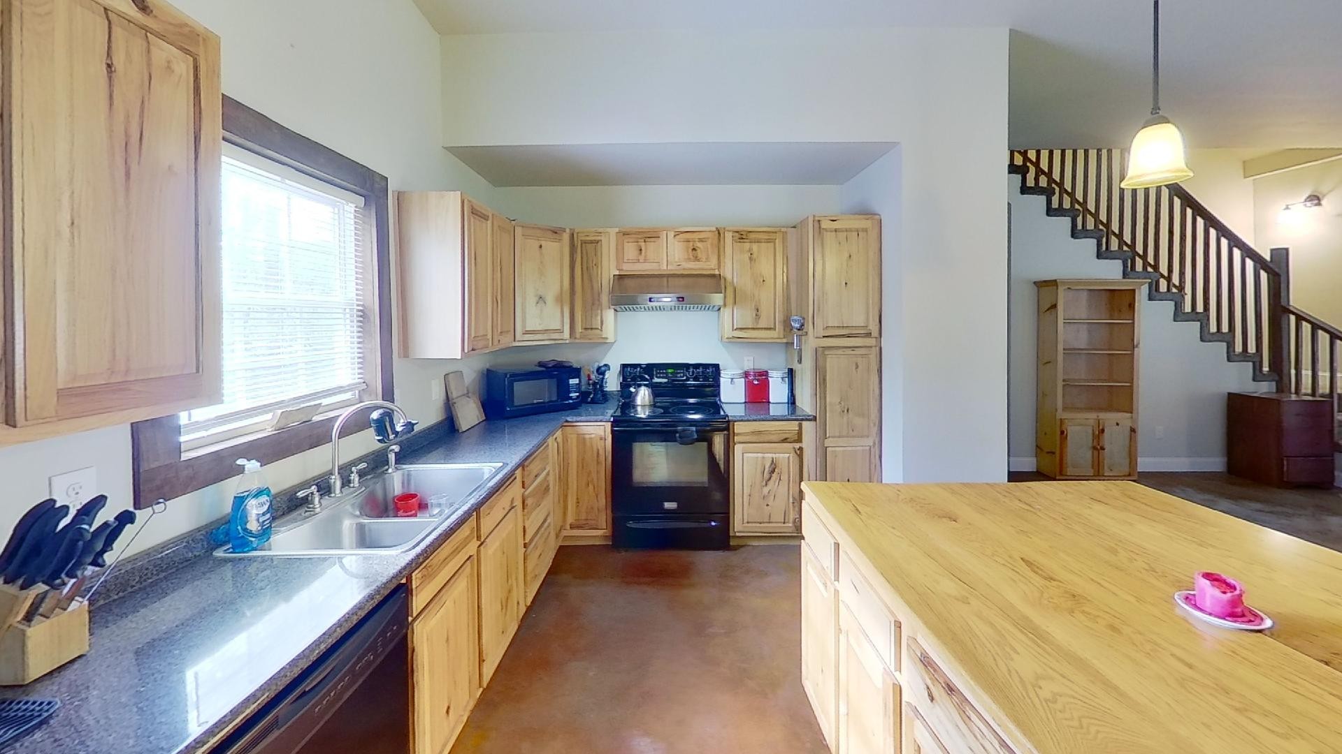 2314 Joe Brown Road Spring Hill, TN 37174 - Photo 21 of 28 a kitchen with sink a stove and a window