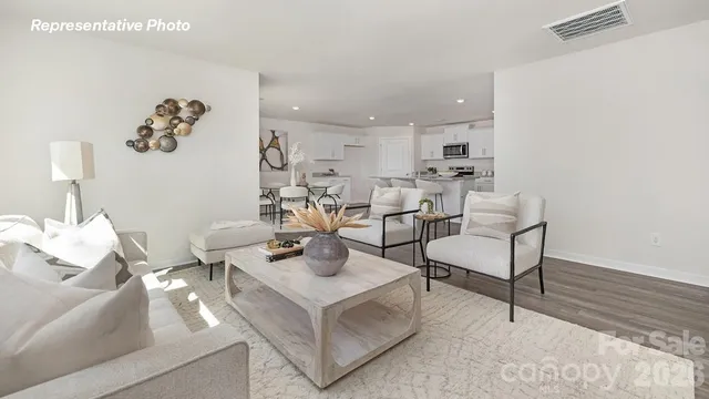 a living room with furniture and a table