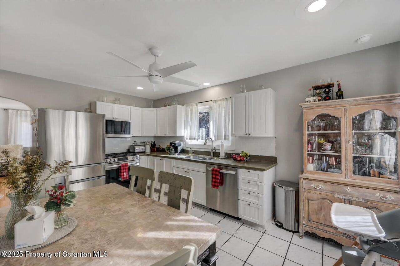 101 Miller Road Clarks Summit, PA 18411 - Photo 11 of 51 a kitchen that has a lot of cabinets a sink and a stove in it