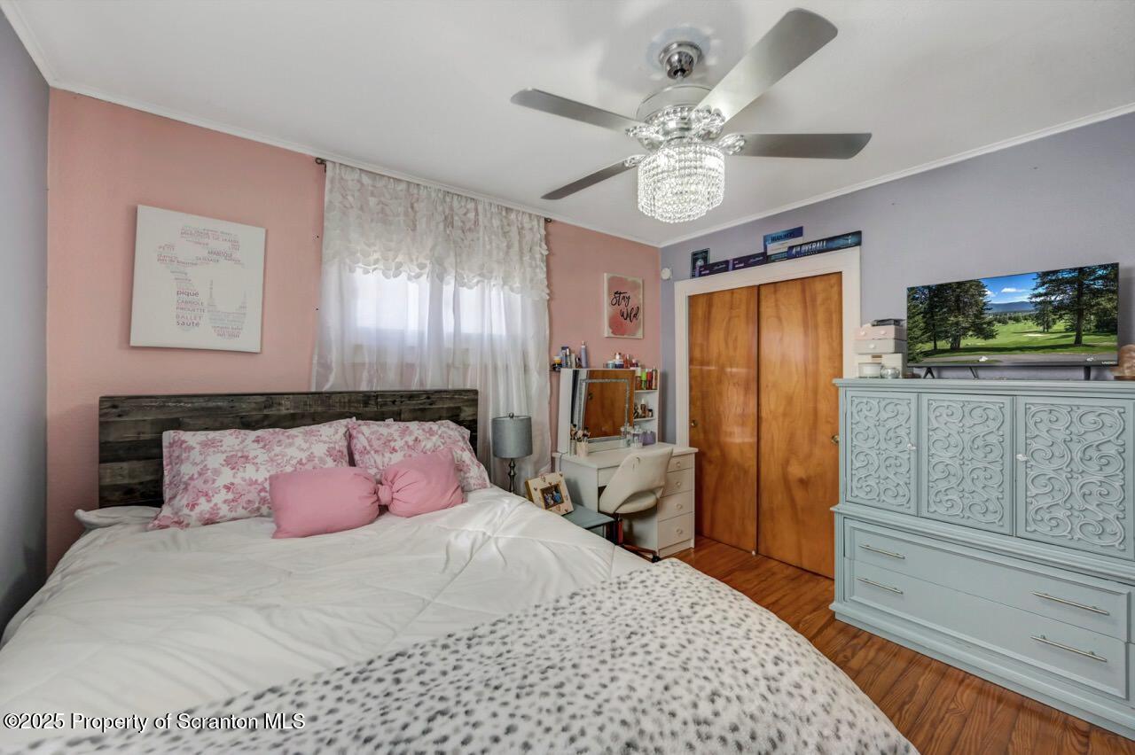 101 Miller Road Clarks Summit, PA 18411 - Photo 20 of 51 a bedroom with a bed mirror on desk and a window