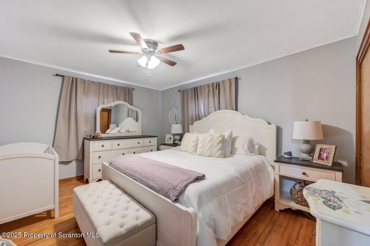 101 Miller Road Clarks Summit, PA 18411 - Photo 25 of 51 a bedroom with a bed and a chandelier