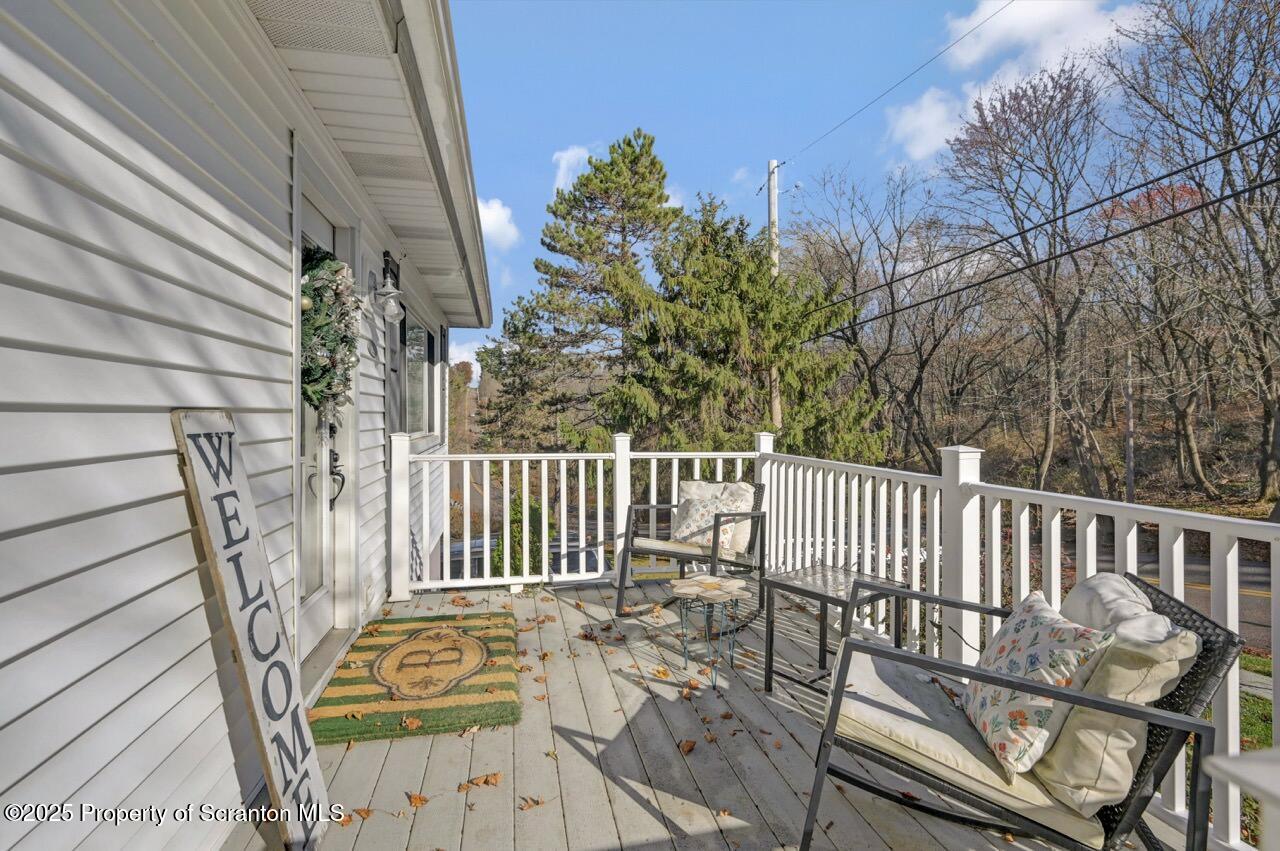 101 Miller Road Clarks Summit, PA 18411 - Photo 3 of 51 a view of a chair and table on the wooden floor