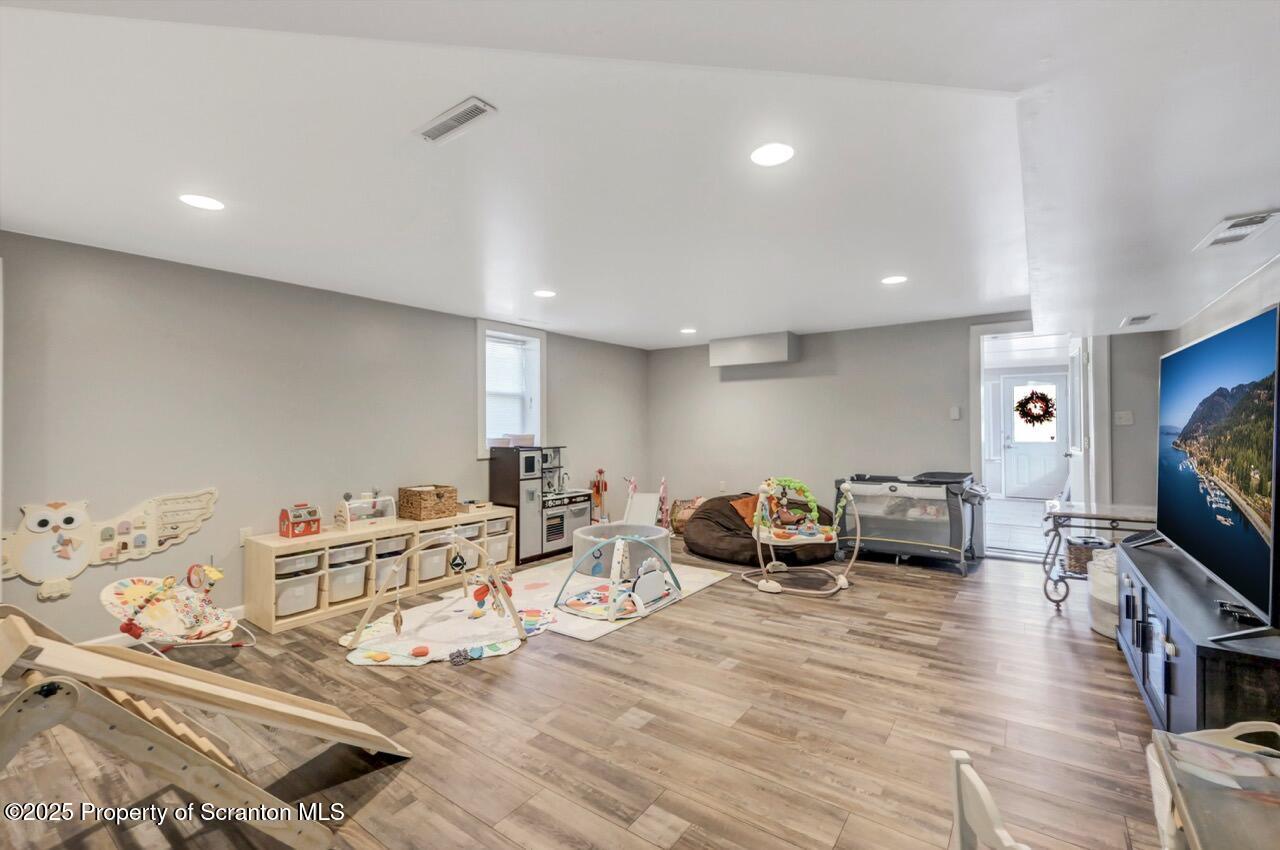 101 Miller Road Clarks Summit, PA 18411 - Photo 31 of 51 a living room with furniture and a flat screen tv
