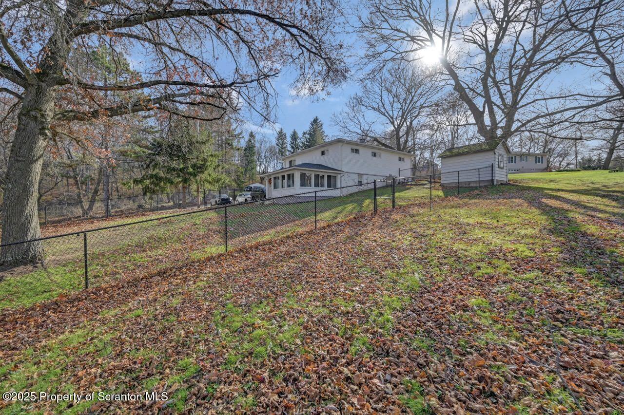 101 Miller Road Clarks Summit, PA 18411 - Photo 45 of 51 a backyard of a house with lots of green space