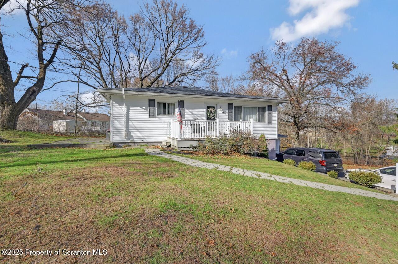 101 Miller Road Clarks Summit, PA 18411 - Photo 48 of 51 a view of a house with a big yard and large trees