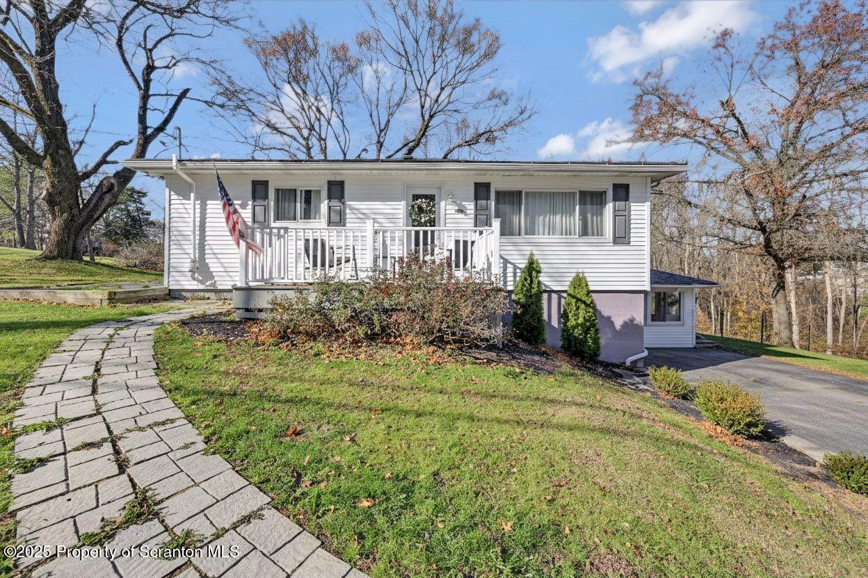 101 Miller Road Clarks Summit, PA 18411 - Photo 49 of 51 a front view of a house with a yard table and chairs