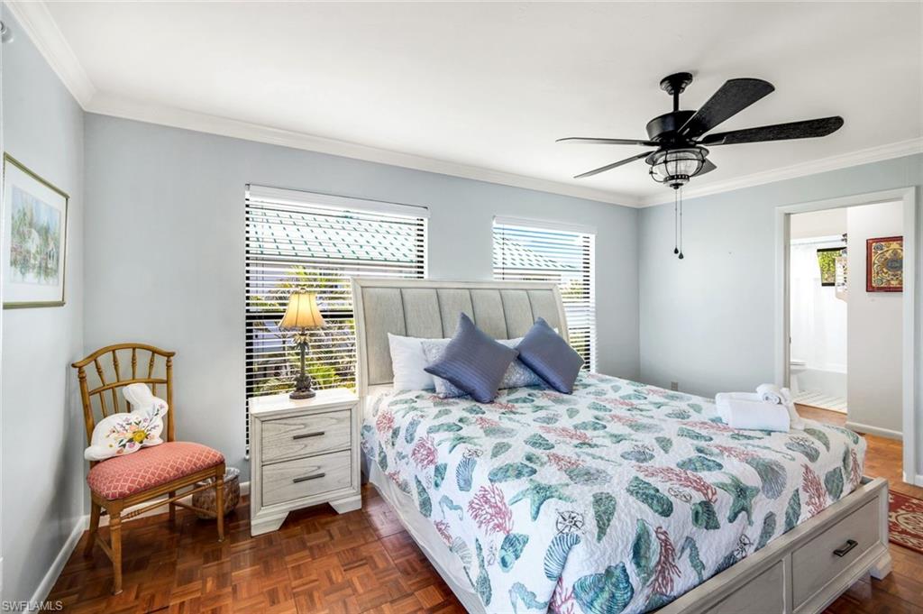 647 Rabbit Road Sanibel, FL 33957 - Photo 16 of 45 a bedroom with a bed and window