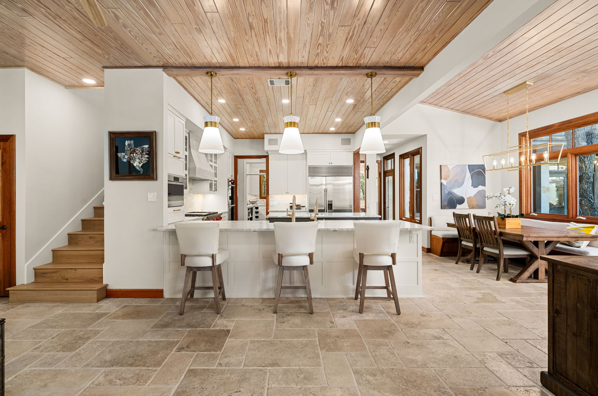 11949 Overlook Pass Austin, TX 78738 - Photo 12 of 40 Kitchen featuring wood ceiling, stone tile flooring, recessed lighting, appliances with stainless steel finishes, and white cabinetry