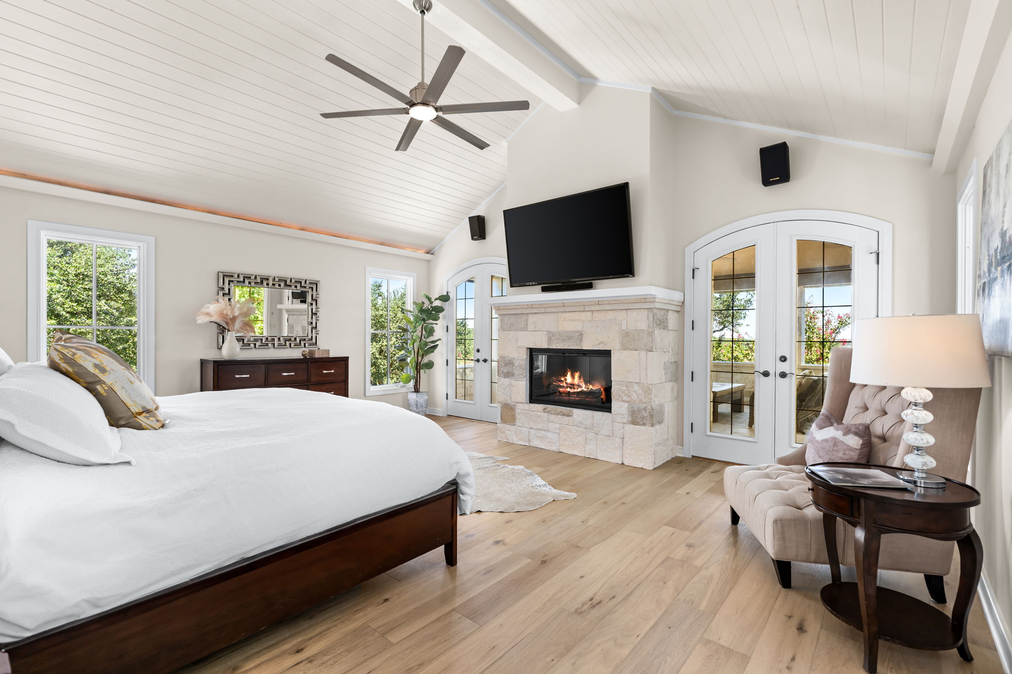 11949 Overlook Pass Austin, TX 78738 - Photo 15 of 40 Bedroom featuring access to exterior, french doors, light wood-style floors, multiple windows, and wooden ceiling