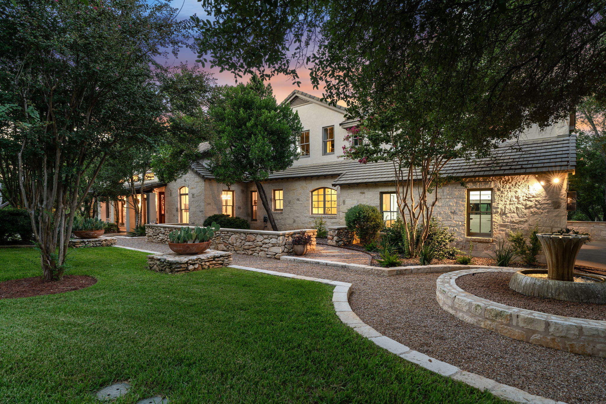 11949 Overlook Pass Austin, TX 78738 - Photo 7 of 40 View of front facade featuring stone siding and a front lawn