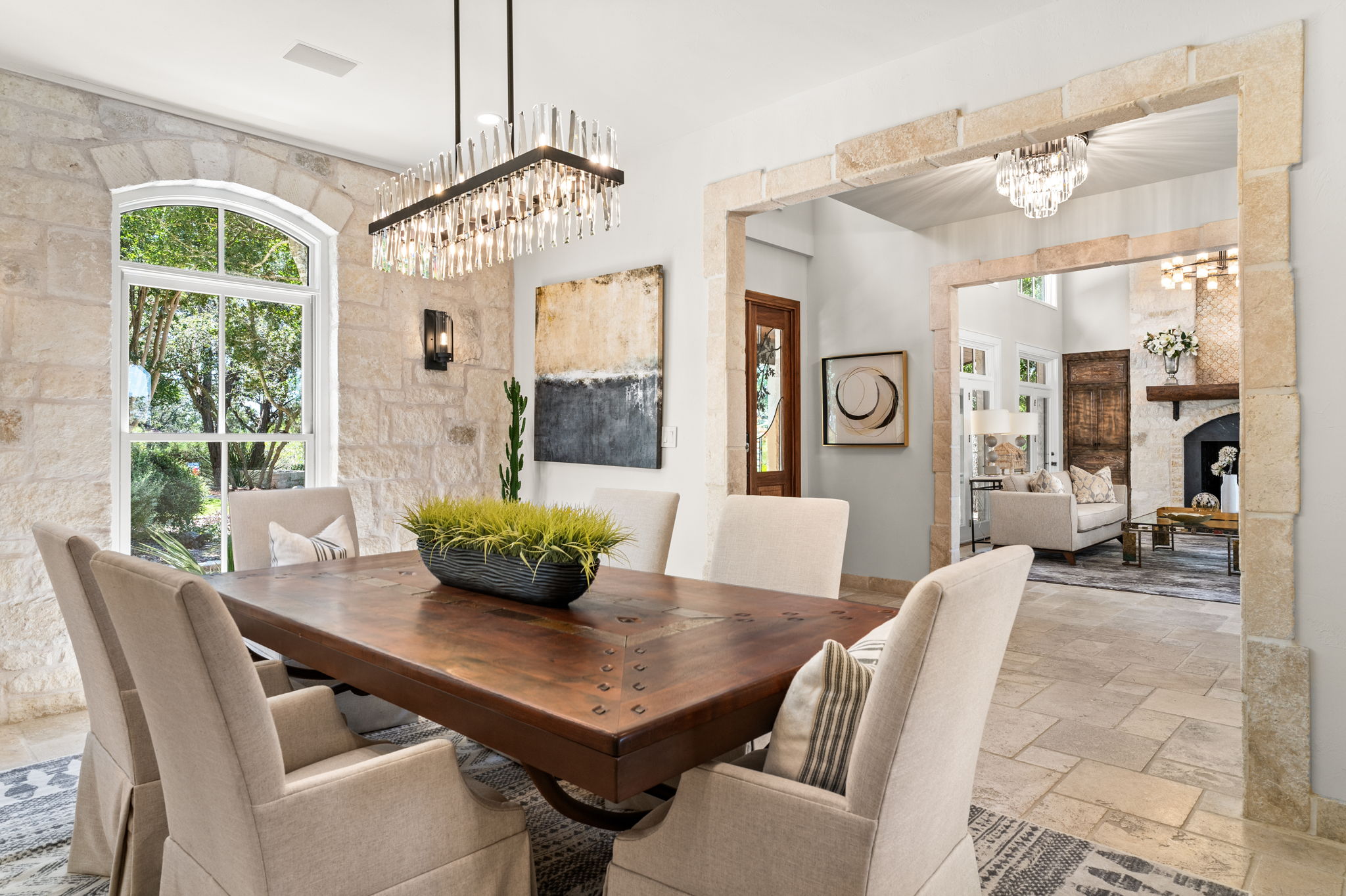 11949 Overlook Pass Austin, TX 78738 - Photo 9 of 40 Dining space featuring a chandelier and stone tile flooring