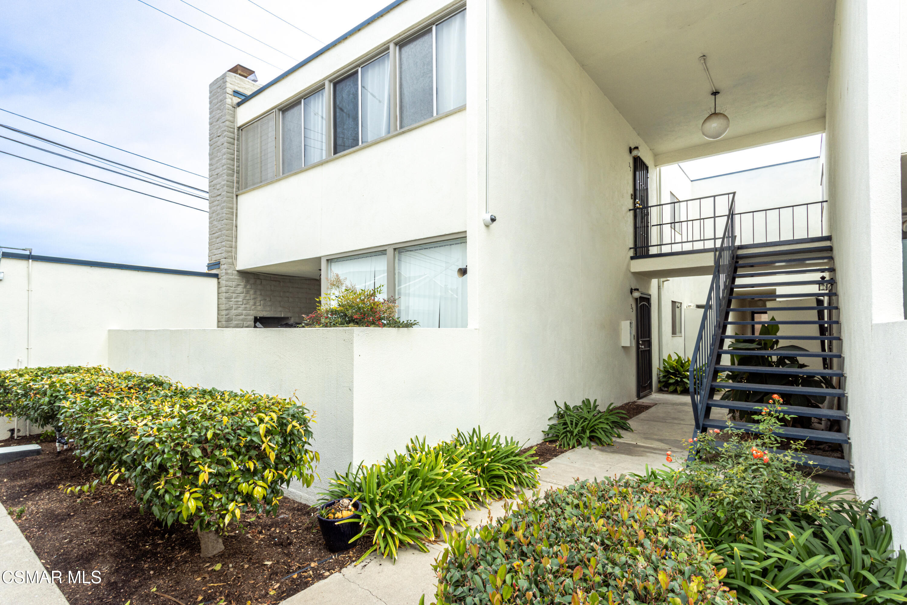 1337 Edgewood Way, Unit 37 Oxnard, CA 93030 - Photo 4 of 13 a view of potted plant in front of a door
