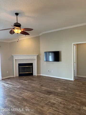 a view of an empty room with a fireplace