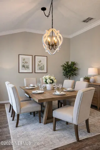 a view of a dining room with furniture