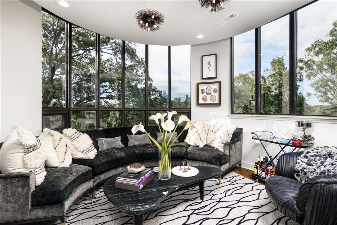 866 Cherokee Road Charlotte, NC 28207 - Photo 12 of 35 a living room with furniture and floor to ceiling windows