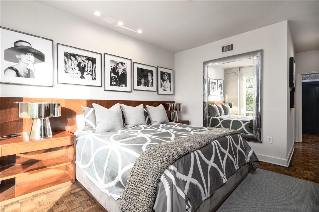 866 Cherokee Road Charlotte, NC 28207 - Photo 23 of 35 a bed sitting in a bedroom next to a window